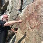 Keith looking at the famous pictograph of Mishipeshu on Agawa Rock at the northeast corner of Lake Superior. Photo credit: Steve Bertman